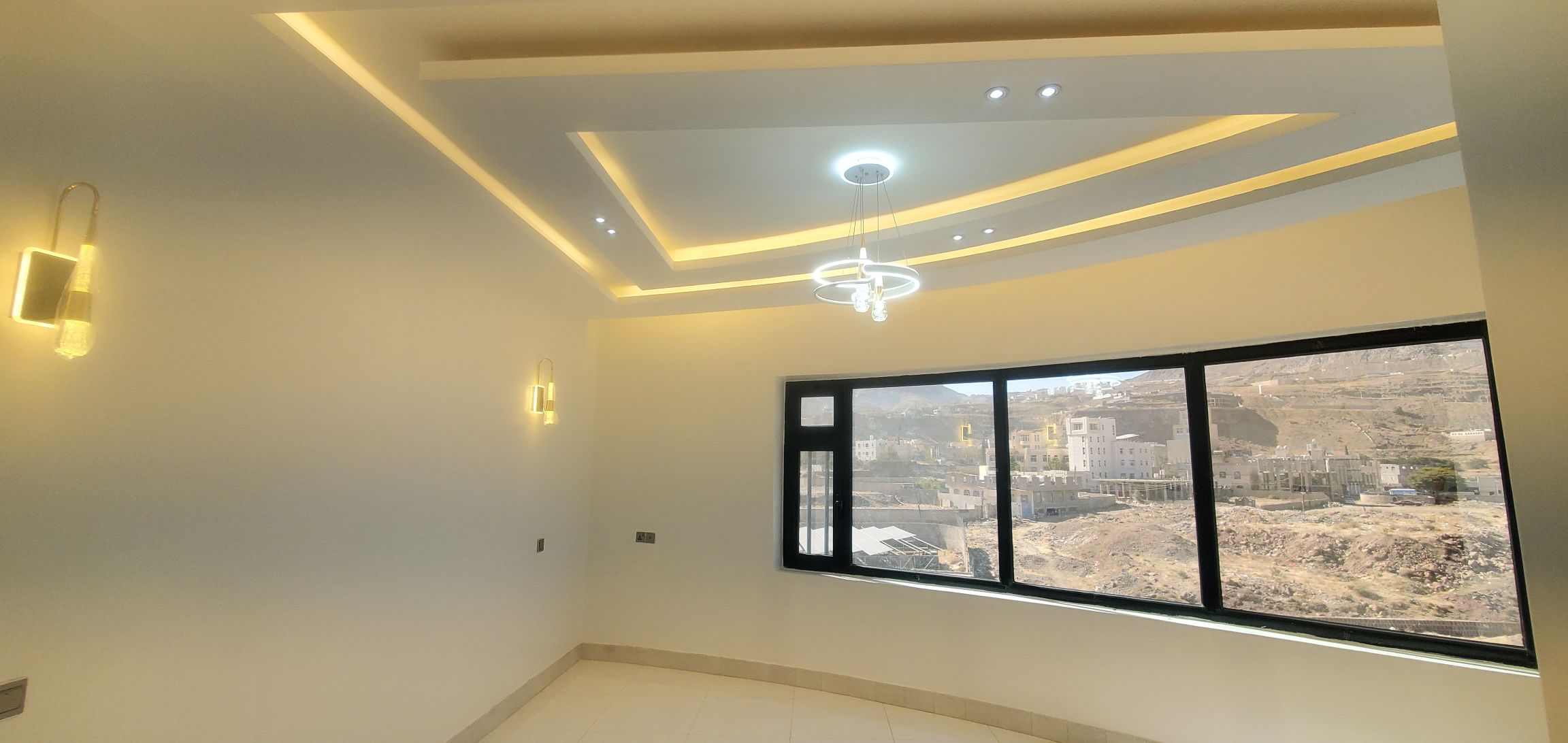 جانب من أعمال الدهان الزيتي النهائي في المبنى (ب) و (ج) - مشروع مجمع البستان السكني.